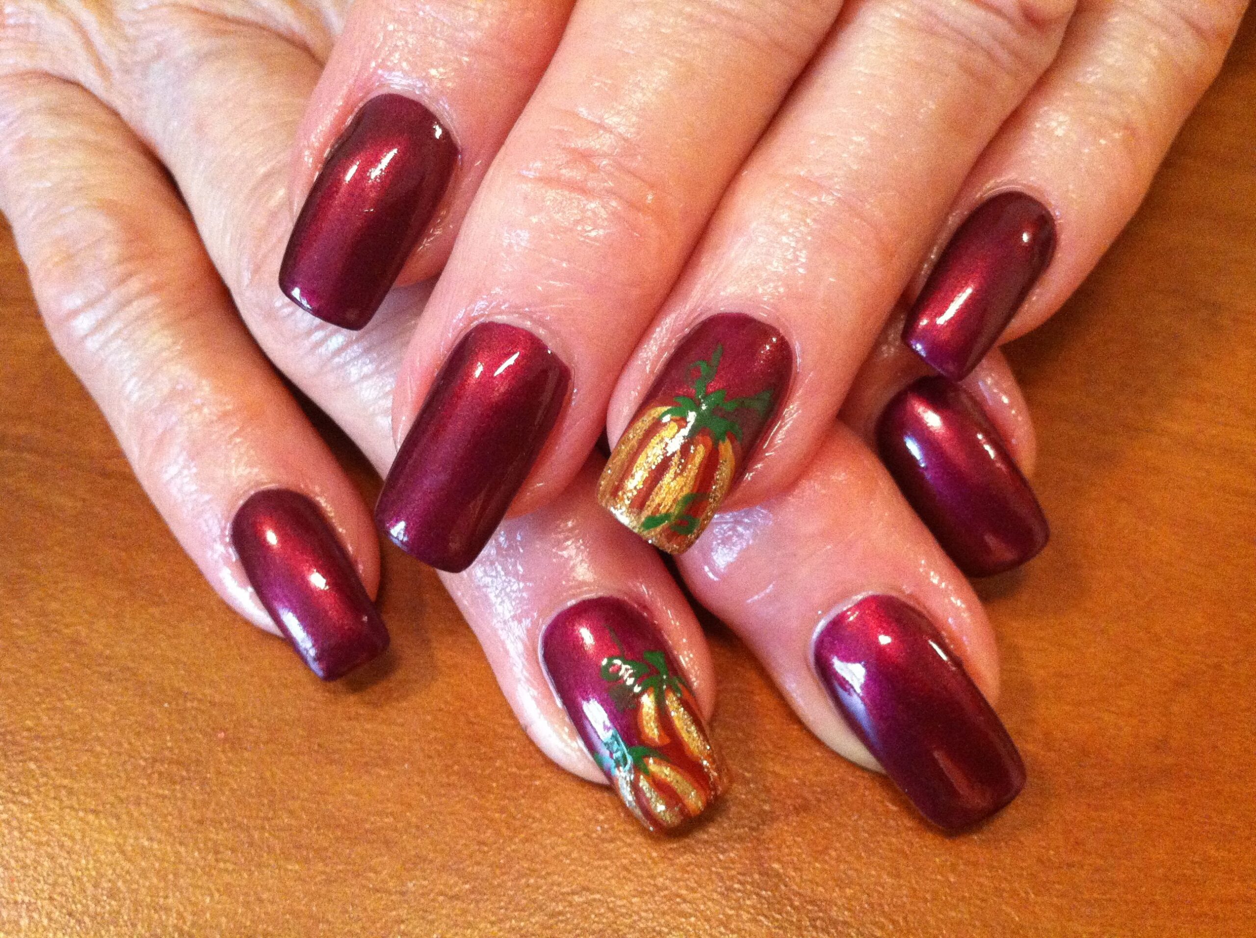 Autumn Elegance: Warm Hues and Whimsical Nails