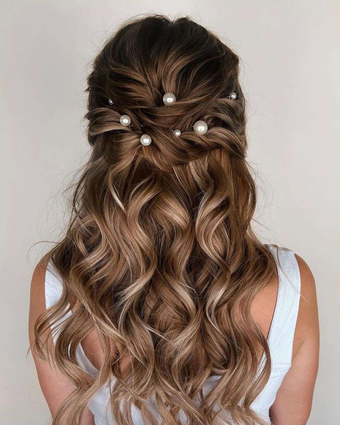 Elegant Whimsy: The Perfect Half-Up Pearl Cascade for Homecoming!