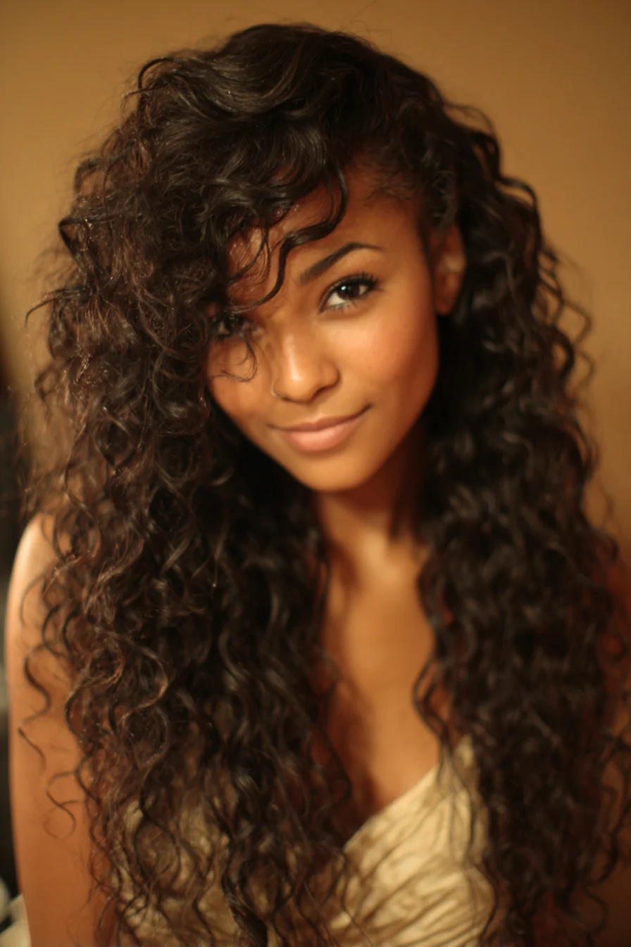Long Voluminous Curly Hair with Side-Swept Fringe