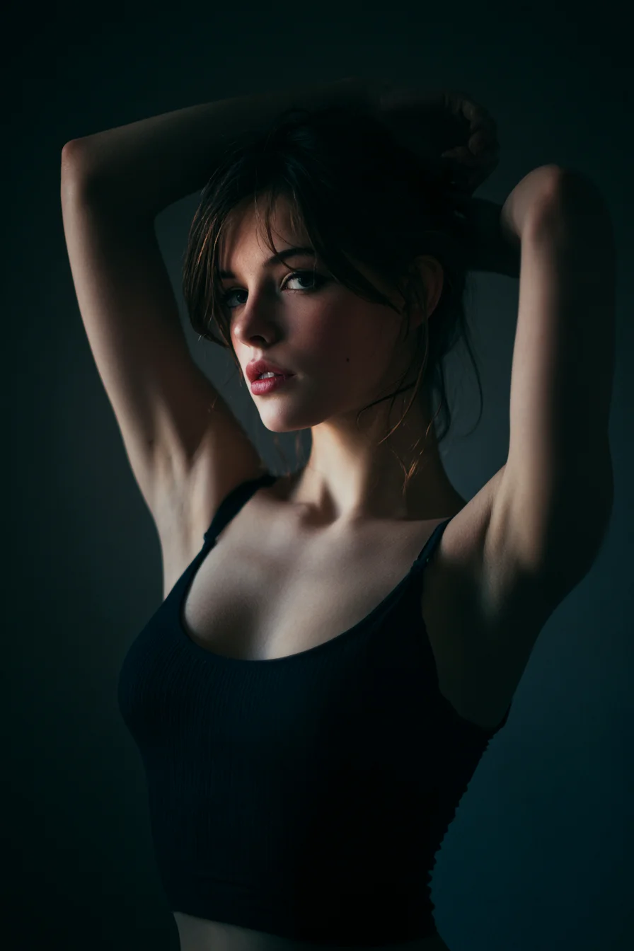 Arms Raised in Moody Studio Light