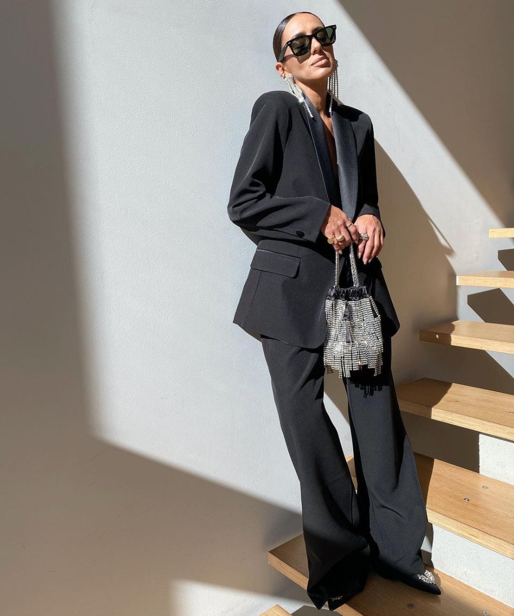 Sophisticated Black Blazer and Wide-Leg Trousers with Sparkly Bag — Winter Party Outfits