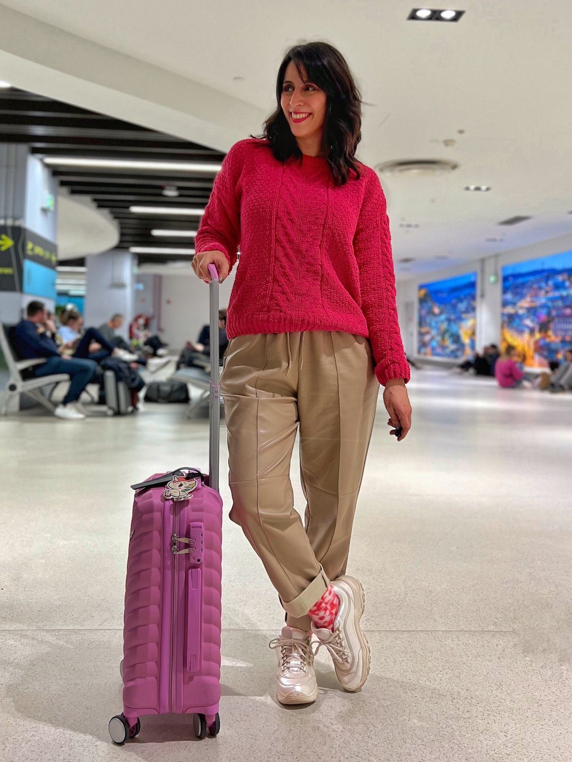 Vibrant Pink Cable-Knit Sweater Paired with Faux Leather Pants — Winter Airport Outfits