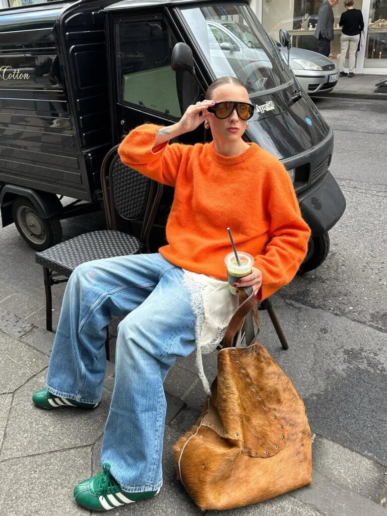 Vibrant Orange Crewneck Sweater with Baggy Blue Jeans Vibrant Orange Crewneck Sweater with Baggy Blue Jeans — Sweater Outfits