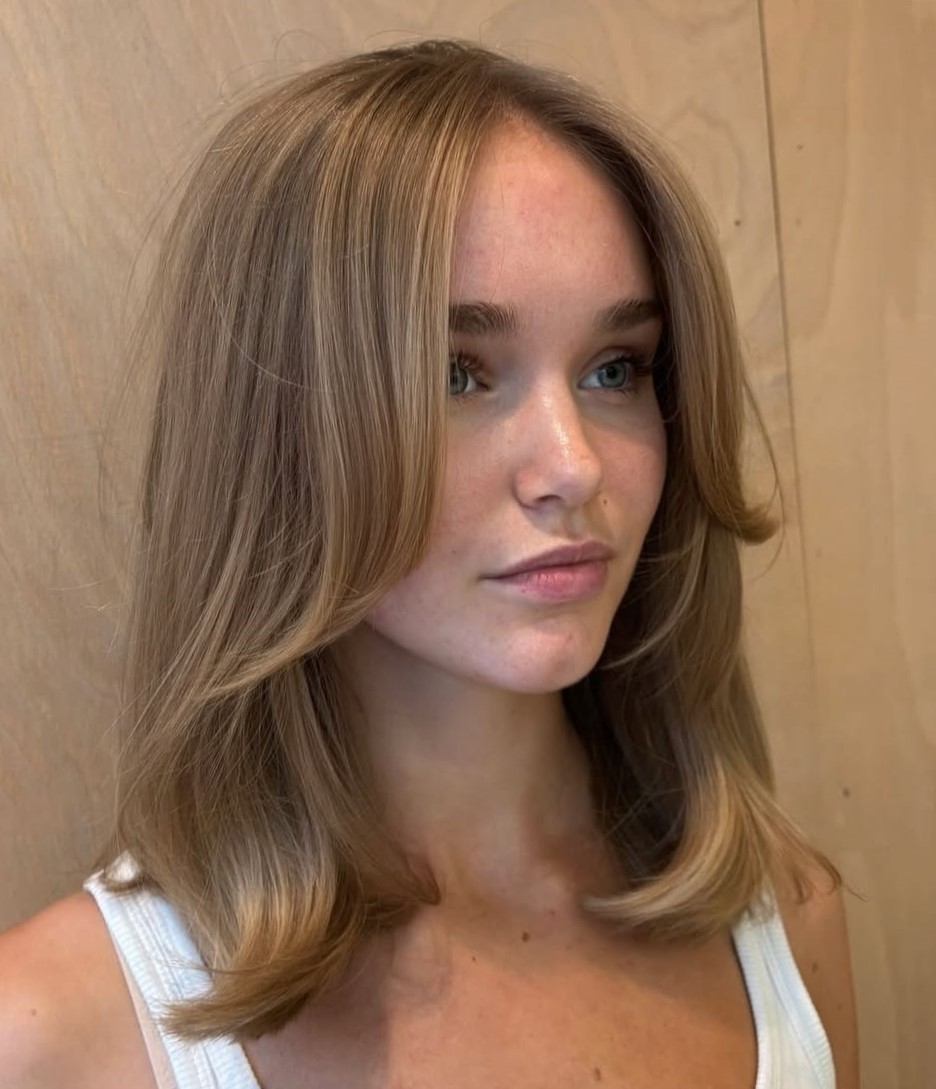 Layered Lob With Side-Swept Bangs Layered Lob With Side-Swept Bangs — Winter Haircuts for Heart Shaped Faces