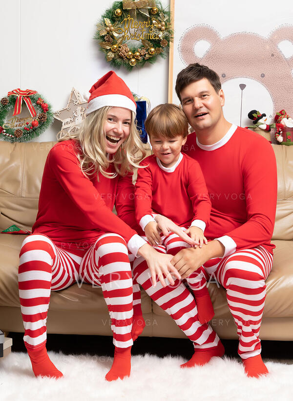 Santa's Squad: Coordinated Red and White Striped Pajamas and Santa Hats — Winter Family Photo Outfits