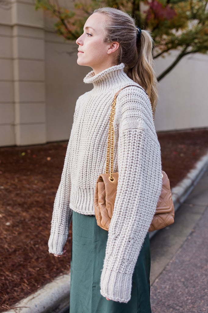 Beige Turtleneck Sweater with Green Midi Skirt and Quilted Bag — Oversized Sweater Outfits