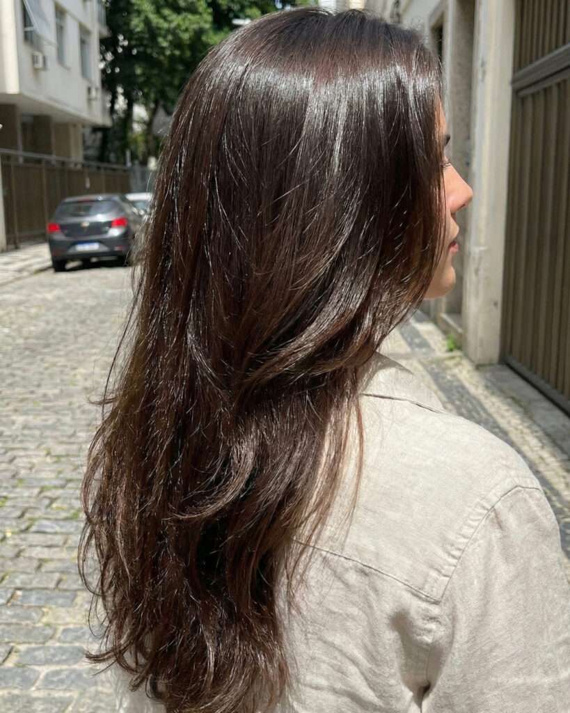 Dark Brown Layers with Air-Dried Waves — Winter Haircuts for Long Faces