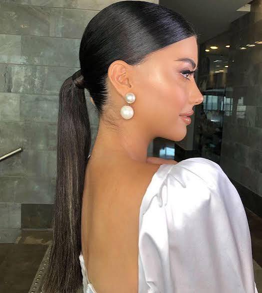Sleek Low Ponytail With Middle Part — Winter Ponytail Hairstyles