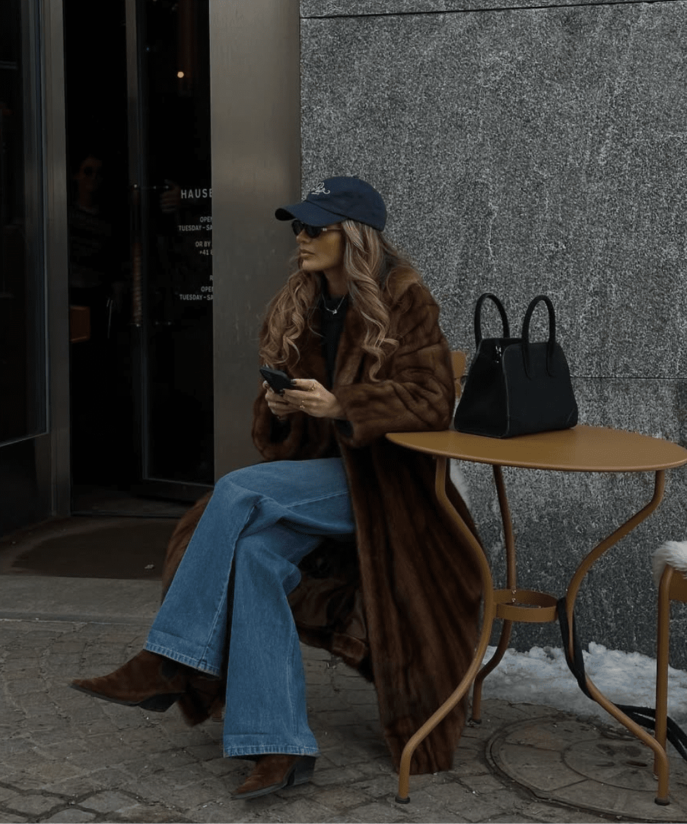 Brown Fur Coat with Baseball Cap and Jeans — Long Coat Outfits