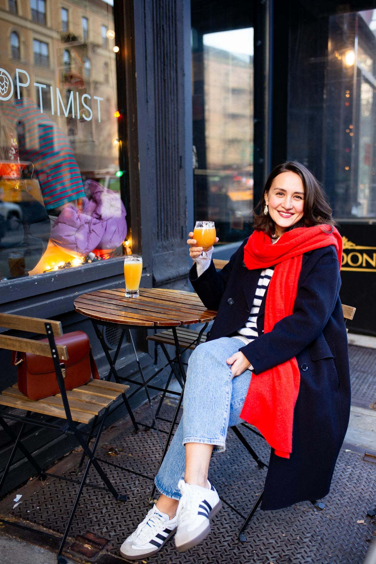 Navy Wool Coat with Red Scarf and White Sneakers — NYC Winter Outfits