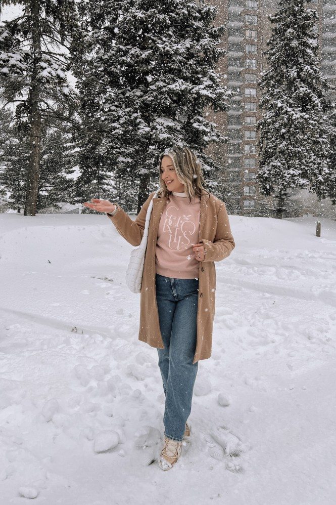 Camel Coat Over Graphic Sweatshirt for Casual Snow Day Chic — Snow Day Outfits