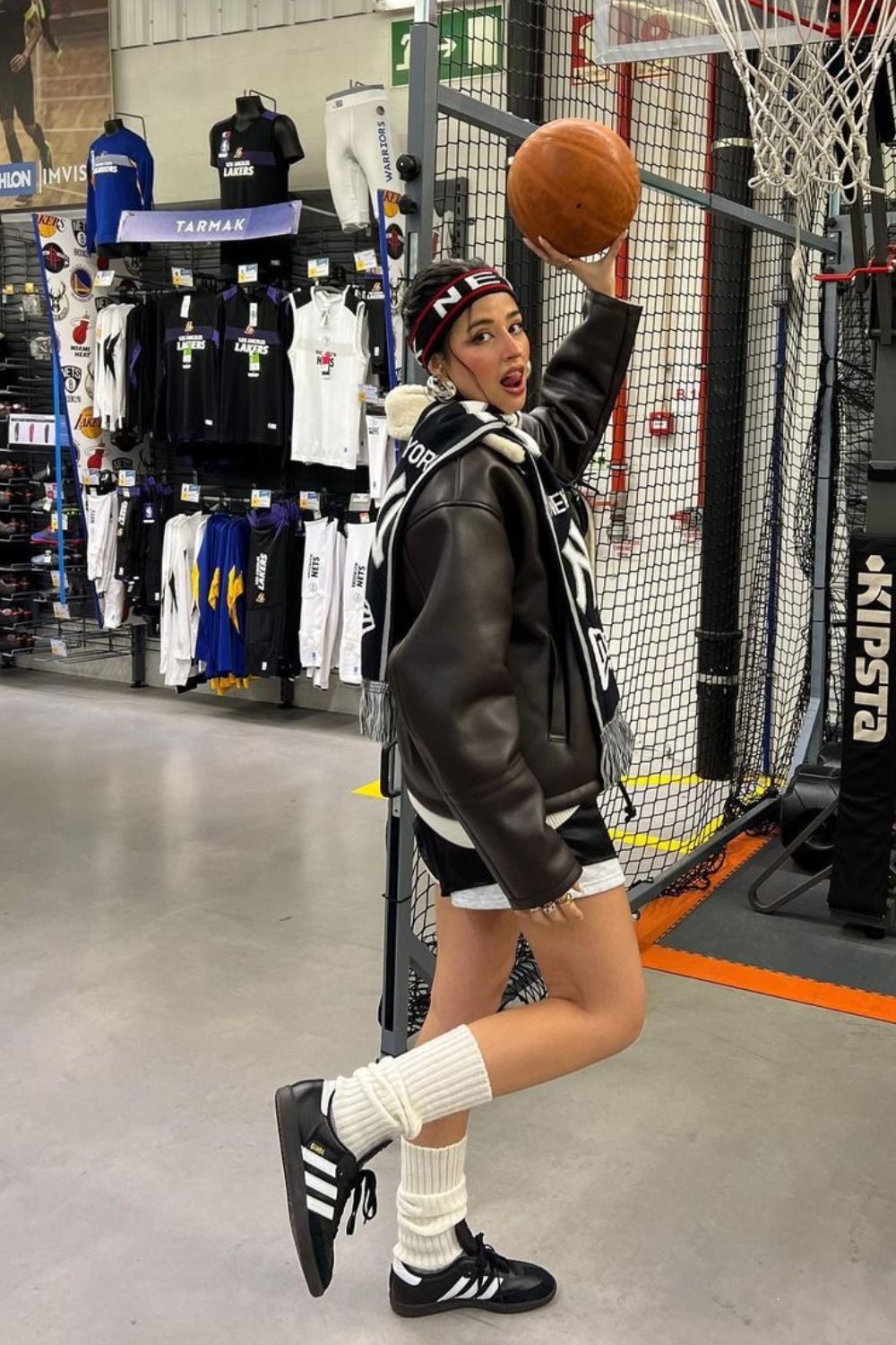 Streetwear Appeal: Brown Leather Jacket with White Leg Warmers and Sneakers — Leg Warmers Outfits