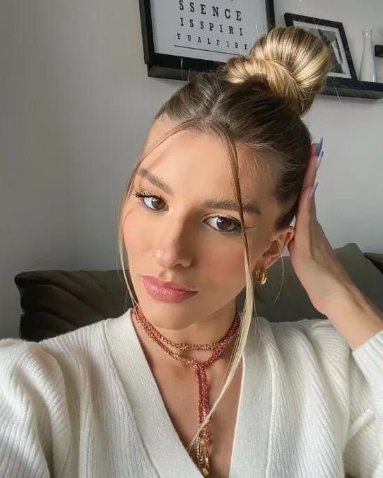 Sleek High Bun with Soft Face-Framing — Winter Bun Hairstyles