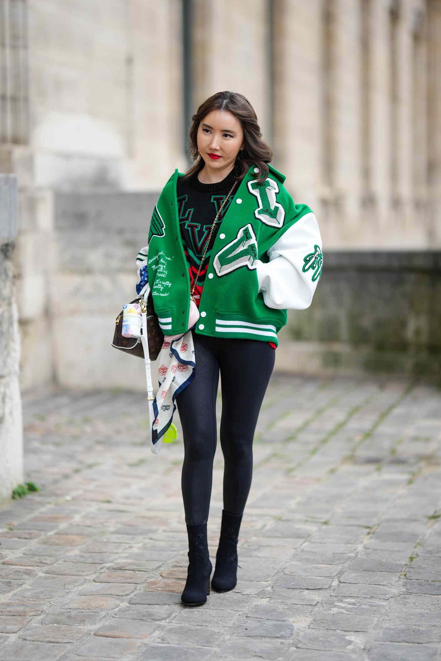 Varsity Jacket Layered Over Black Leggings — Winter Outfits with Leggings