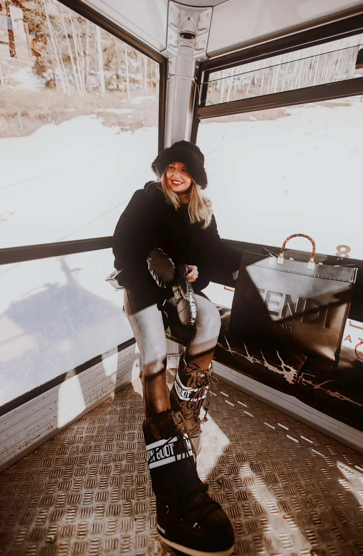 Glamorous Apres-Ski with an Oversized Jacket, Moon Boots, and Fur Hat Glamorous Apres-Ski with an Oversized Jacket, Moon Boots, and Fur Hat — Apres Ski Outfits