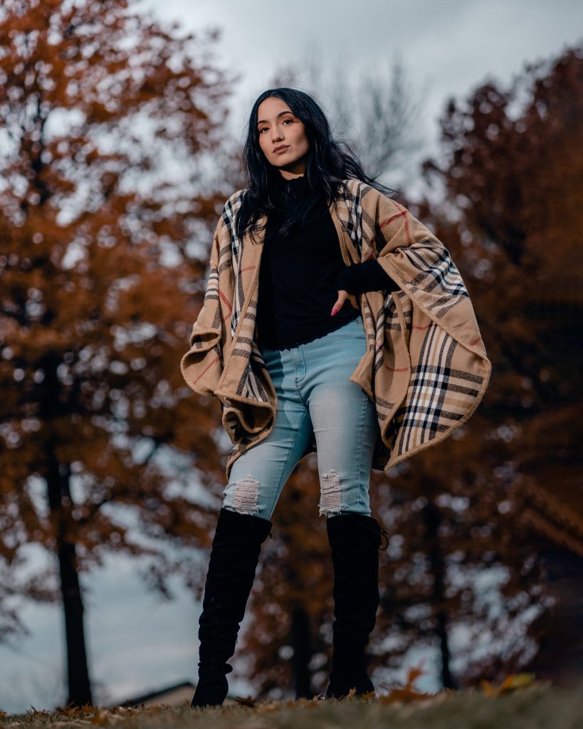 Casual Autumn Style: Riding Boots with Ripped Jeans and a Plaid Cape — Riding Boots Outfits