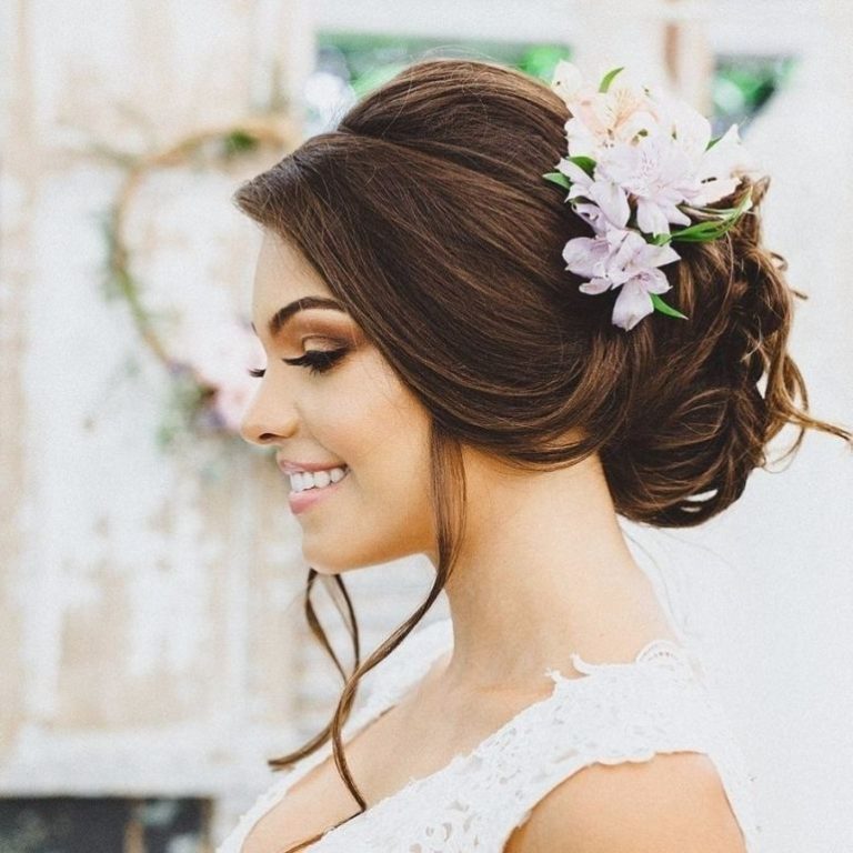 Voluminous Side-Swept Updo With Flowers — Winter Formal Hairstyles