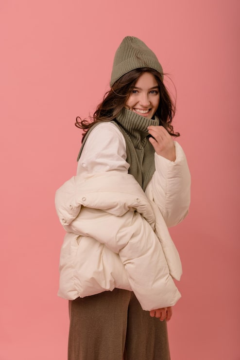 Draped Cream Puffer Jacket with Olive Green Knit Vest Draped Cream Puffer Jacket with Olive Green Knit Vest — Winter Photoshoot Outfits