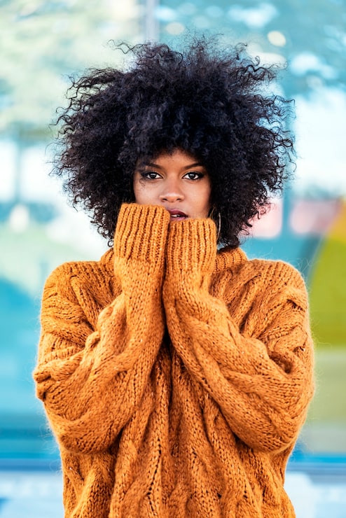 Voluminous Black Afro Shoulder Length Voluminous Black Afro Shoulder Length — Winter Haircuts for Black Women