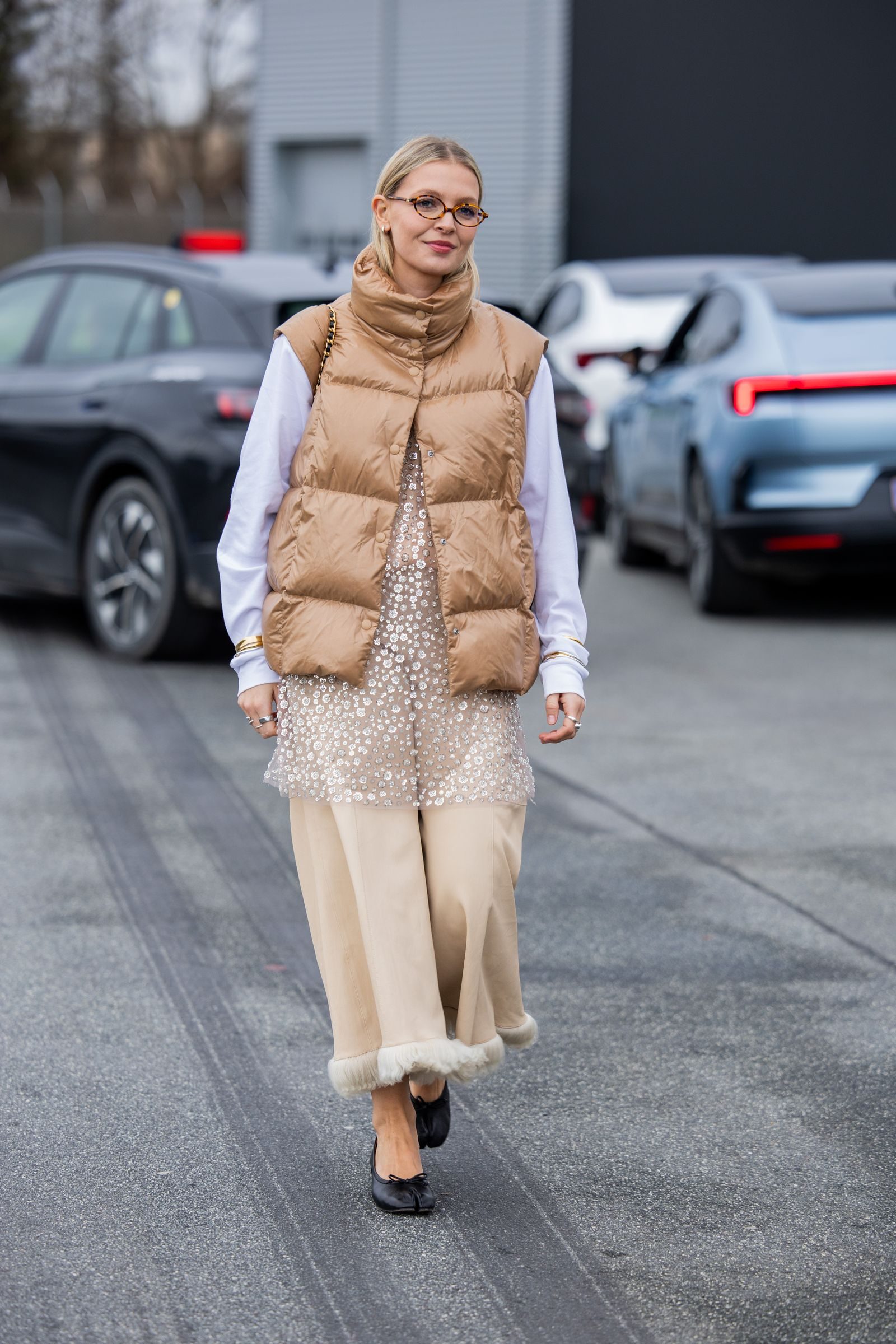 Tan Puffer Vest Over Sequined Dress and White Shirt — Puffer Vest Outfits