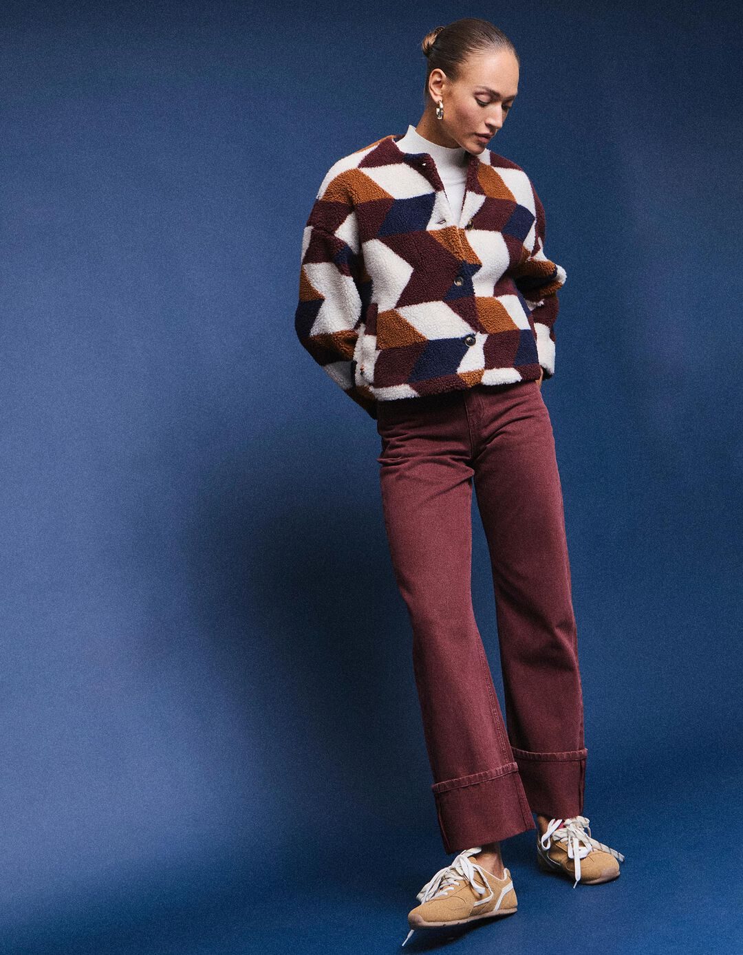 Geometric Cardigan Over Turtleneck and Cuffed Jeans: Cozy Knitwear Combo — Winter to Spring Transition Outfits