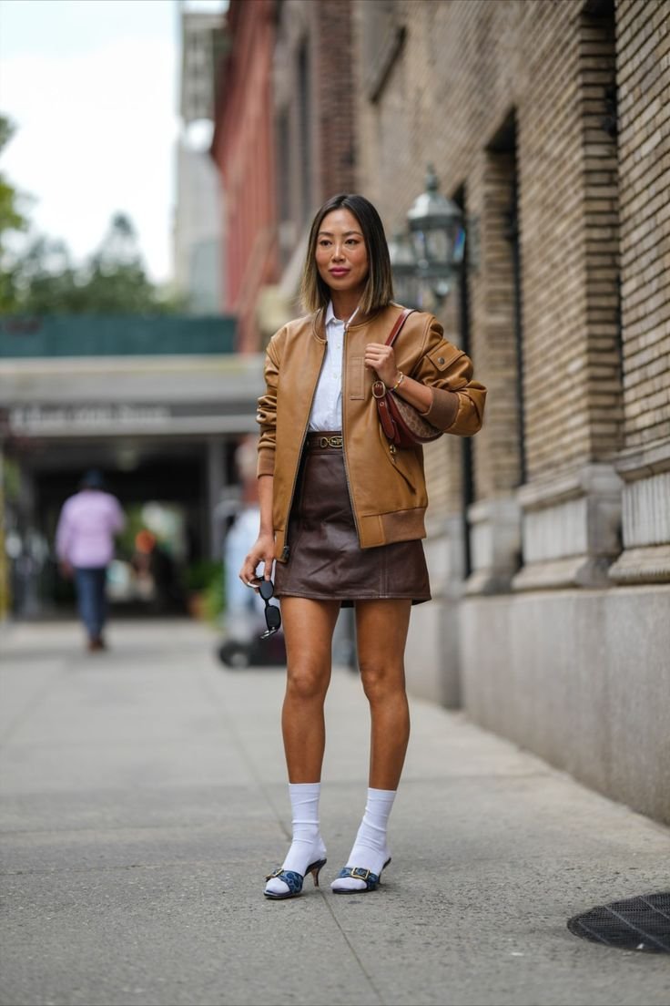 Edgy Casual: Brown Leather Bomber with Mini Skirt and Heels — Brown Coat Outfits
