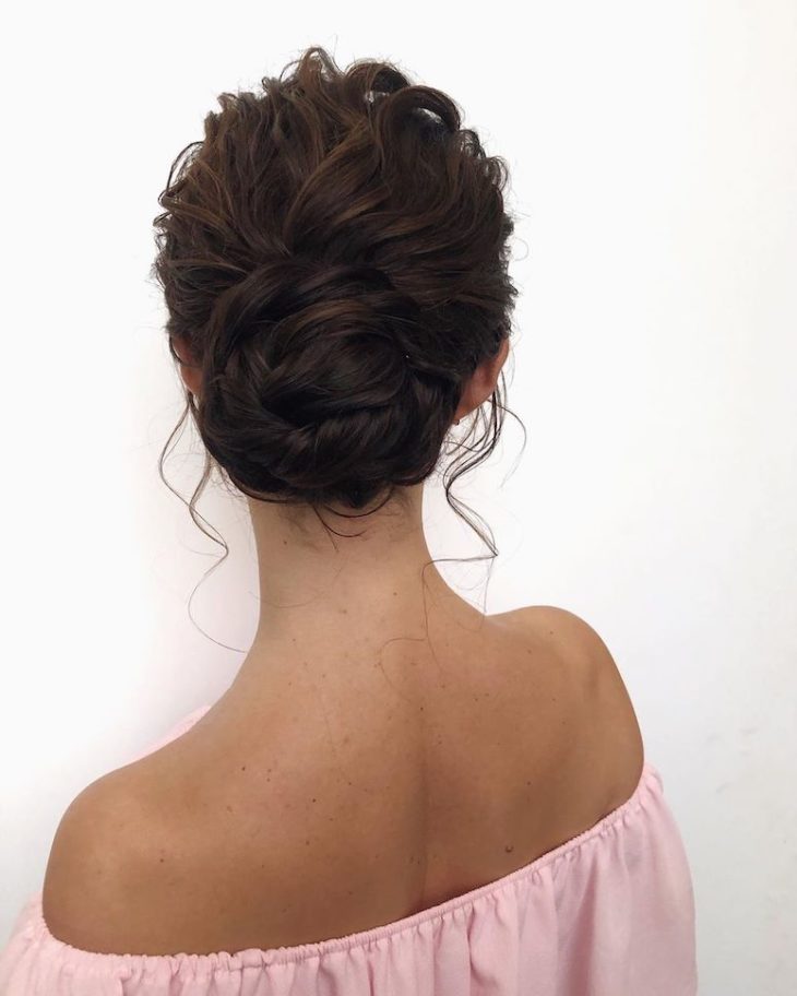 Low Messy Bun with Romantic Tendrils — Winter Updos