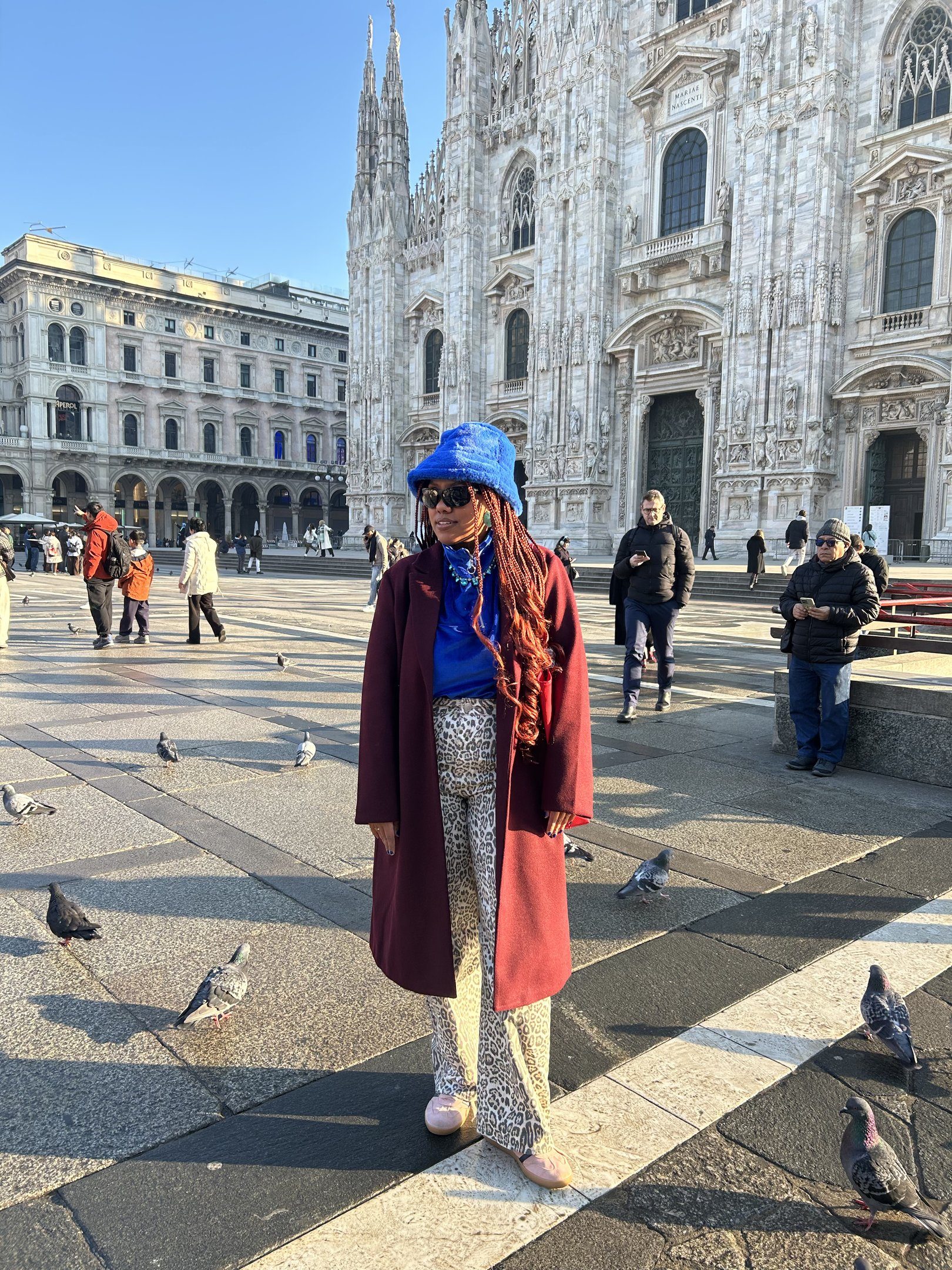 Burgundy Coat with Blue Bucket Hat and Patterned Trousers — Italy Winter Outfits