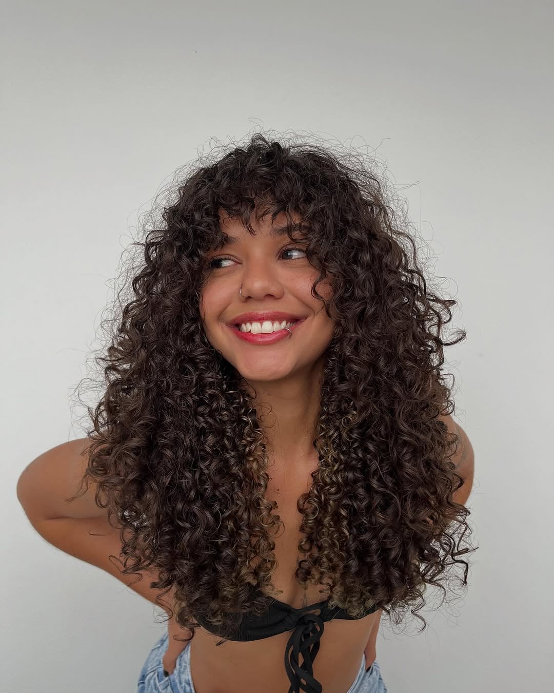 Layered Collarbone Bob With Curtain Bangs — Winter Haircuts for Curly Hair