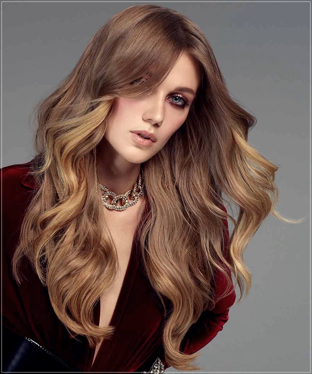 Voluminous Honey Blonde Waves With Side Bangs — Winter Hairstyles for Long Hair