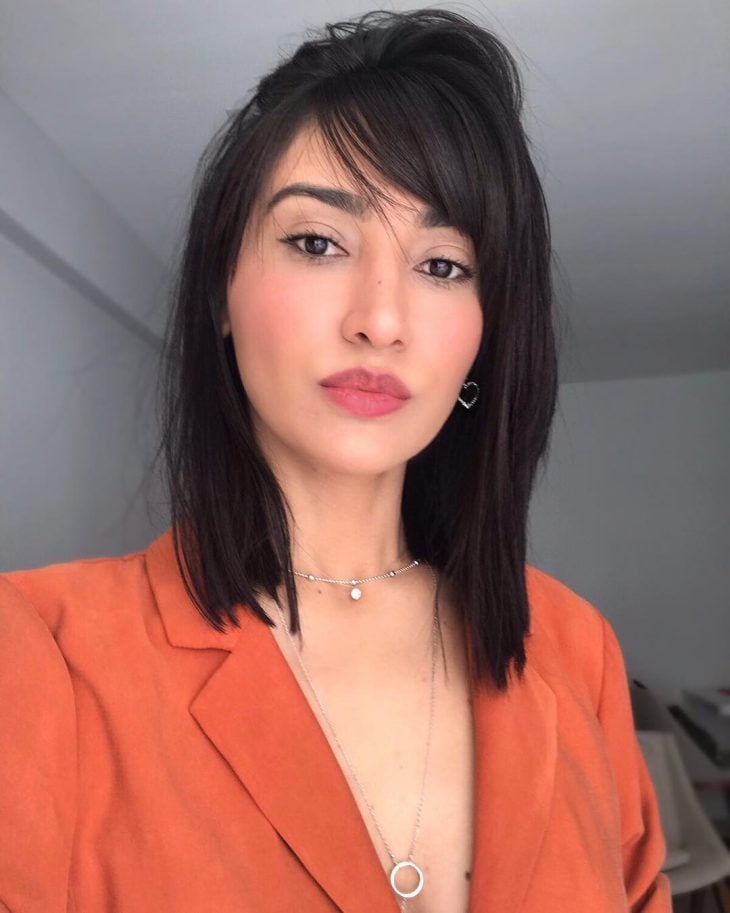 The Sleek Long Bob With Blunt Bangs — Winter Hairstyles for Round Faces