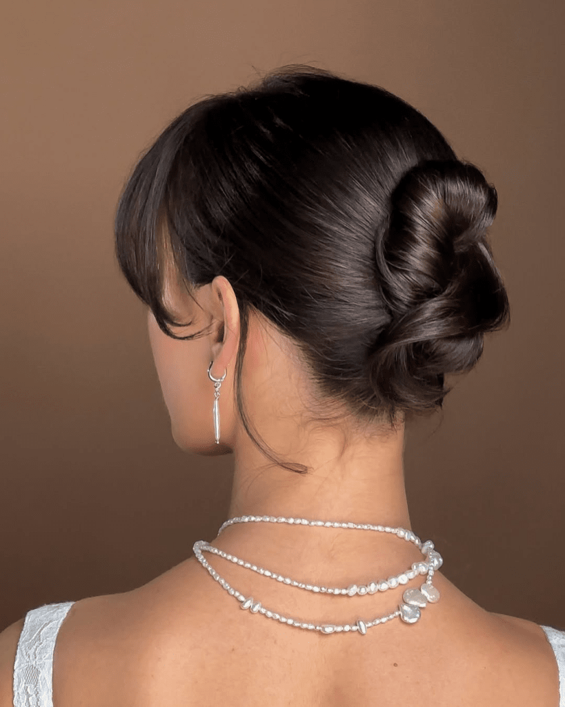 Neat Low Twisted Bun — Winter Protective Hairstyles