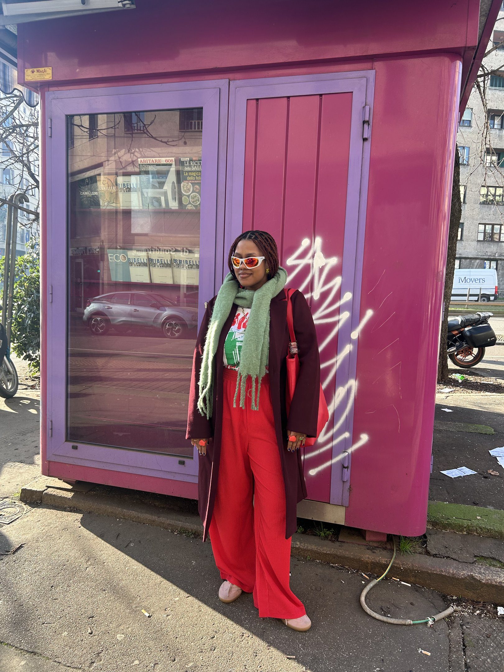 Bright Red Trousers Command Attention Under a Burgundy Coat — Colorful Winter Outfits