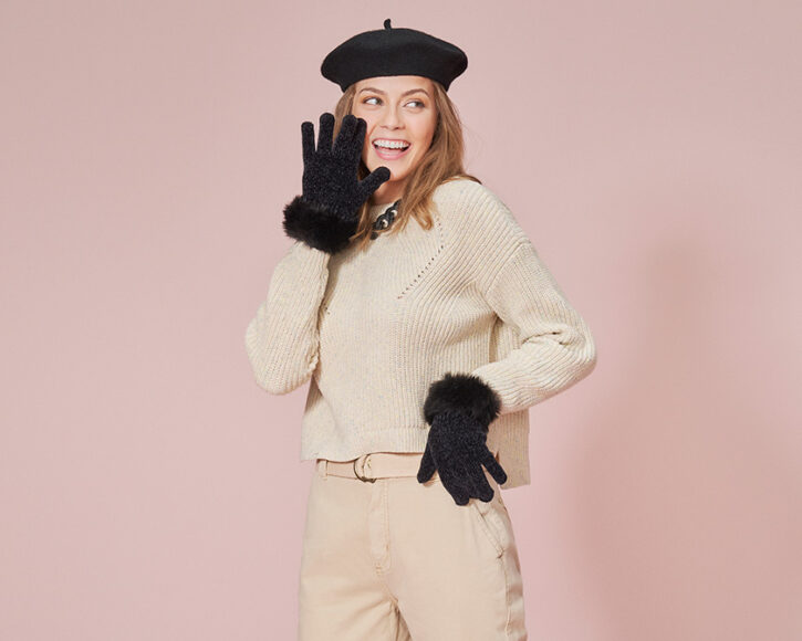 Cream Knit Sweater with Beige Pants and Fur-Trimmed Gloves — Winter Outfits for Warm Weather