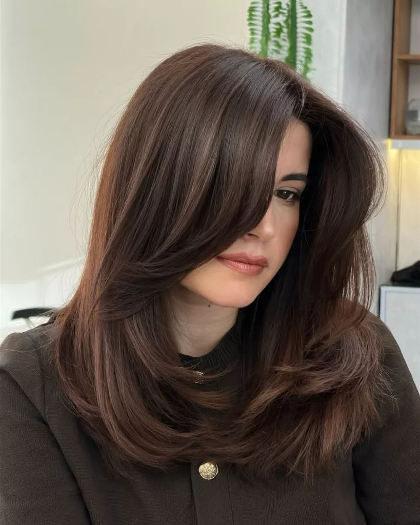 Mid-Back Layered Cut With Side-Swept Bangs — Medium Length Winter Haircuts