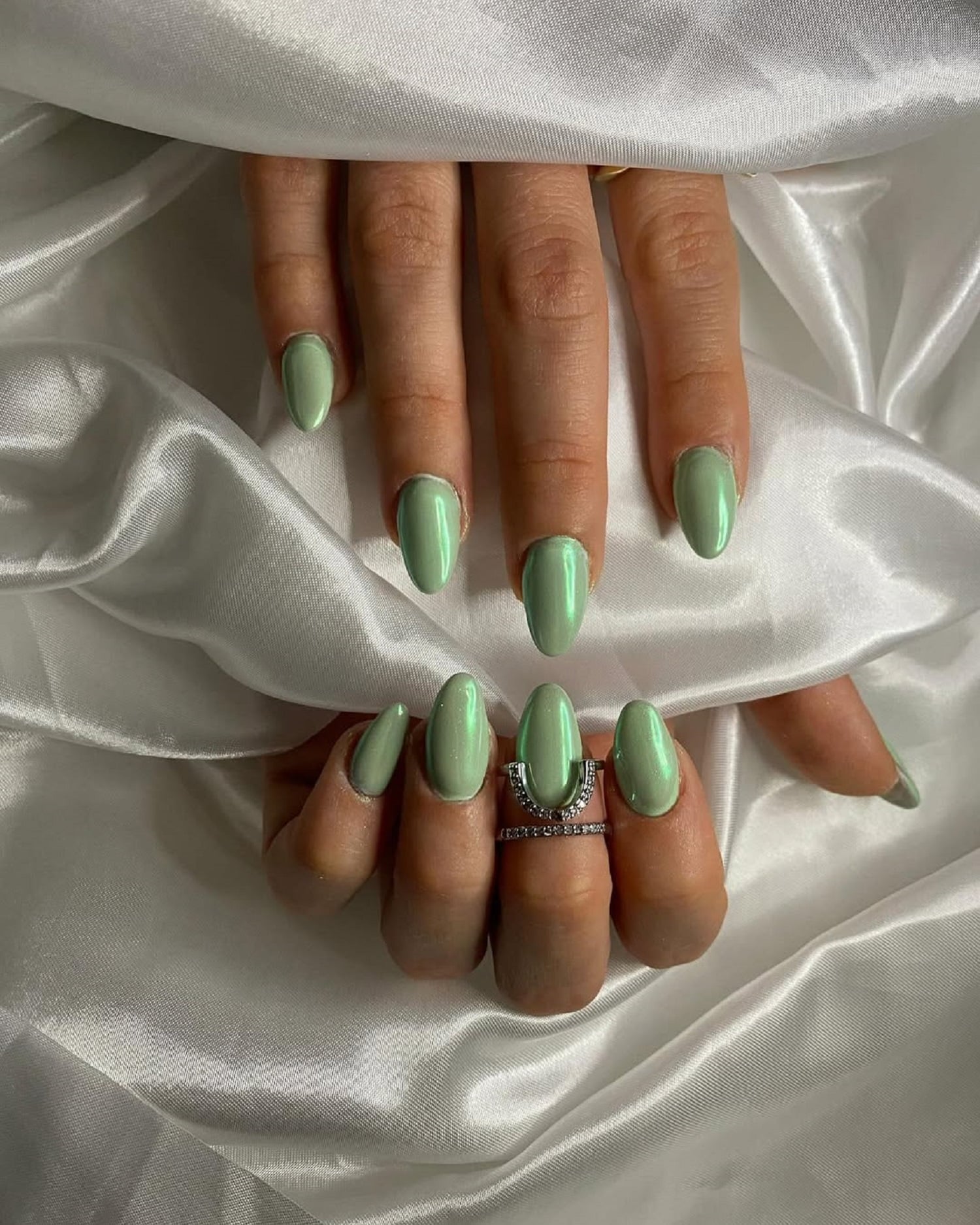 Light Green Pearlescent Oval Nails Light Green Pearlescent Oval Nails — Winter Nail Colors for Women Over 50