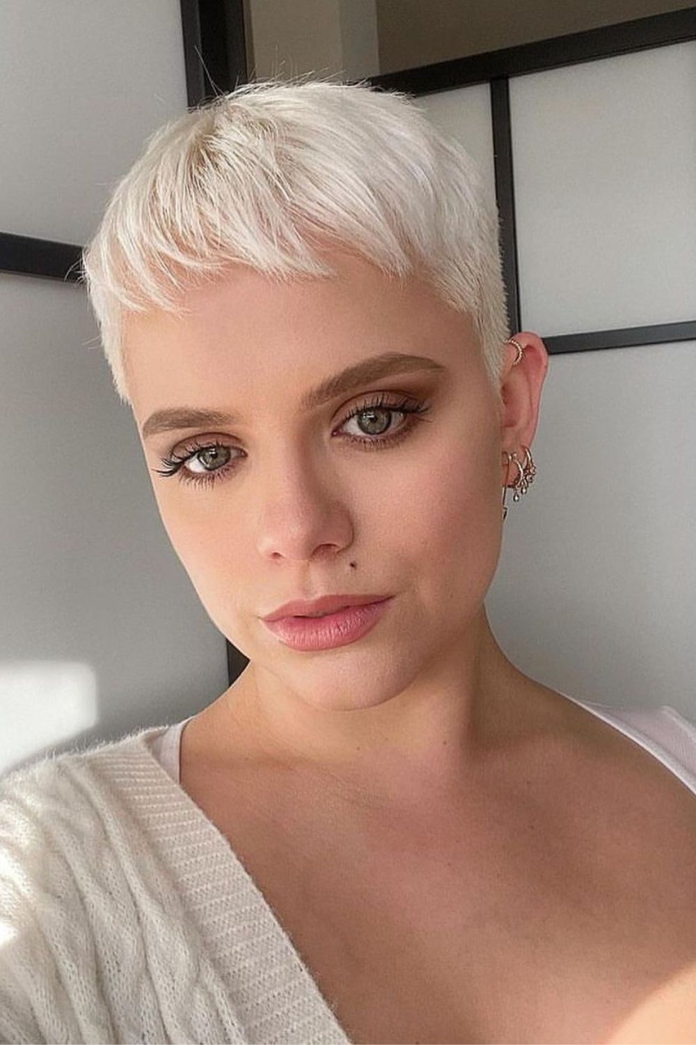 Chic Platinum Pixie With Textured Forward Bangs — Winter Pixie Haircuts