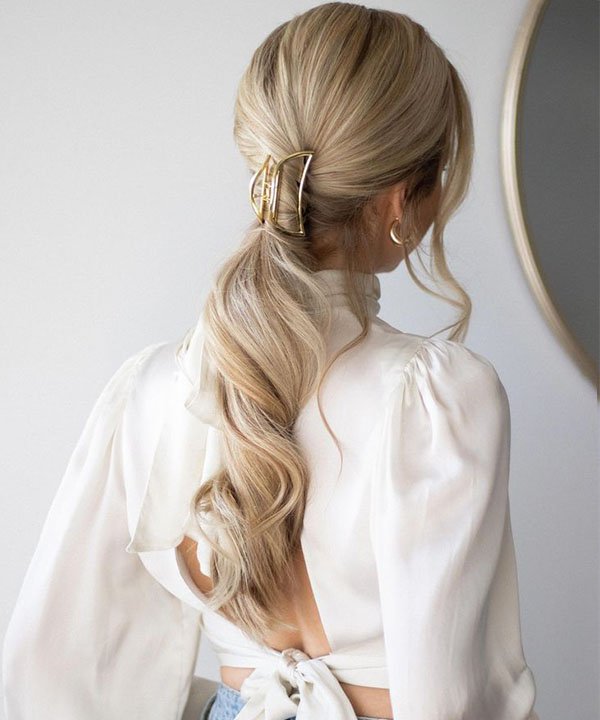 Sleek Low Ponytail With Accessory — Winter Ponytail Hairstyles