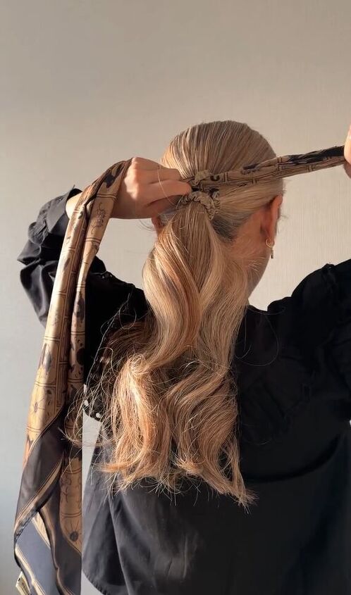 Wavy Blonde Ponytail with Hands Tying Scarf Wavy Blonde Ponytail with Hands Tying Scarf — Winter Hairstyles with Scarf