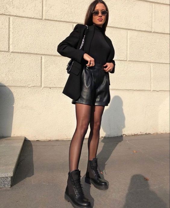 Monochromatic Black Evening Look with Leather Shorts and Sheer Tights Monochromatic Black Evening Look with Leather Shorts and Sheer Tights — Combat Boots Outfits