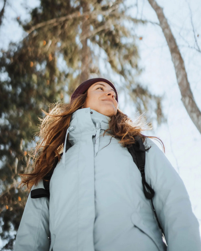 Light Blue Puffer with Burgundy Beanie in Snowy Forest — Winter Hiking Outfits