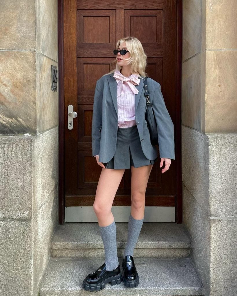 Oversized Blazer with a Bow-Detail Shirt and Pleated Mini Skirt — Paris Winter Outfits