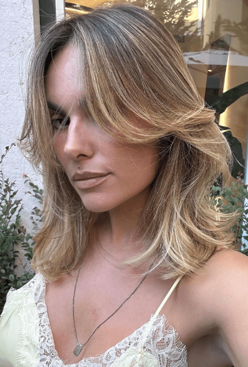 Dark Blonde Shag With Curtain Bangs Dark Blonde Shag With Curtain Bangs — Winter Hair Colors for Pale Skin