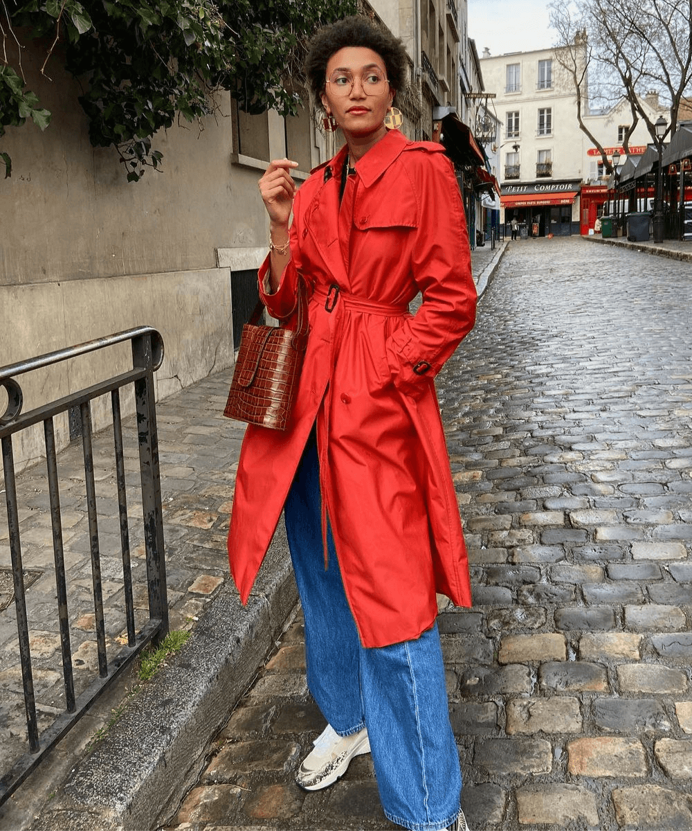 Vibrant Red Trench Coat Over Blue Jeans and White Sneakers — Paris Winter Outfits