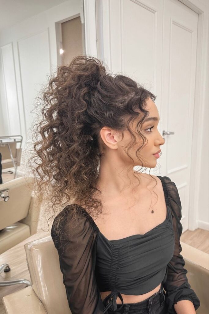 High Ponytail With Voluminous Curls — Winter Hairstyles for Long Hair