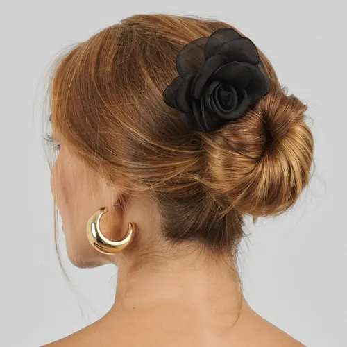 Low Bun with a Chic Flower Accent — Winter Bun Hairstyles