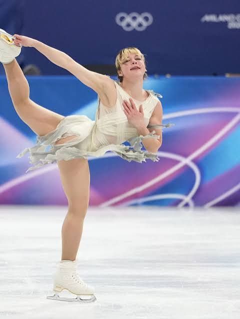 White Competition Dress with Sheer Sleeves and Layered Ruffled Skirt White Competition Dress with Sheer Sleeves and Layered Ruffled Skirt — Ice Skating Outfits