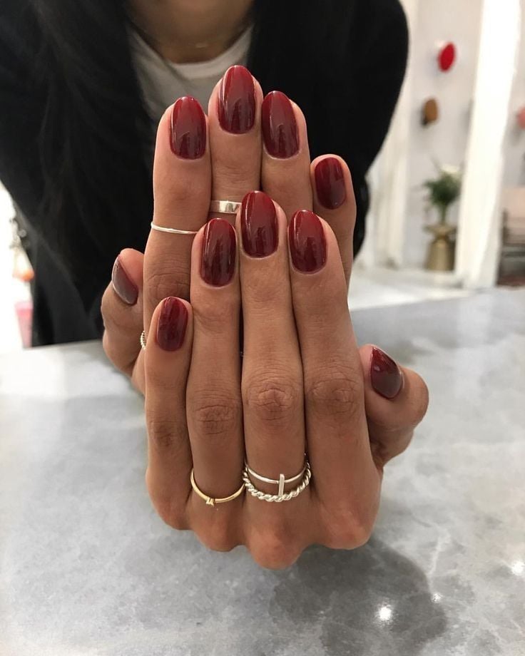 Deep Oxblood Red Glossy Oval Nails Deep Oxblood Red Glossy Oval Nails — Winter Nail Colors for Women Over 50