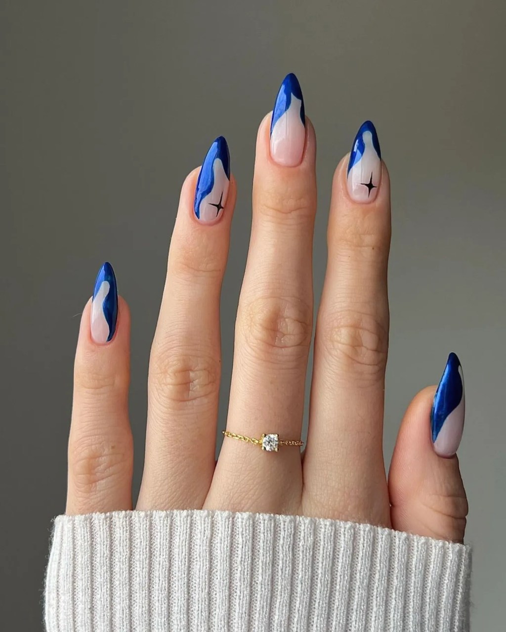 Abstract Blue Swirls with Star Accents Almond Nails Abstract Blue Swirls with Star Accents Almond Nails — Winter Almond Nails