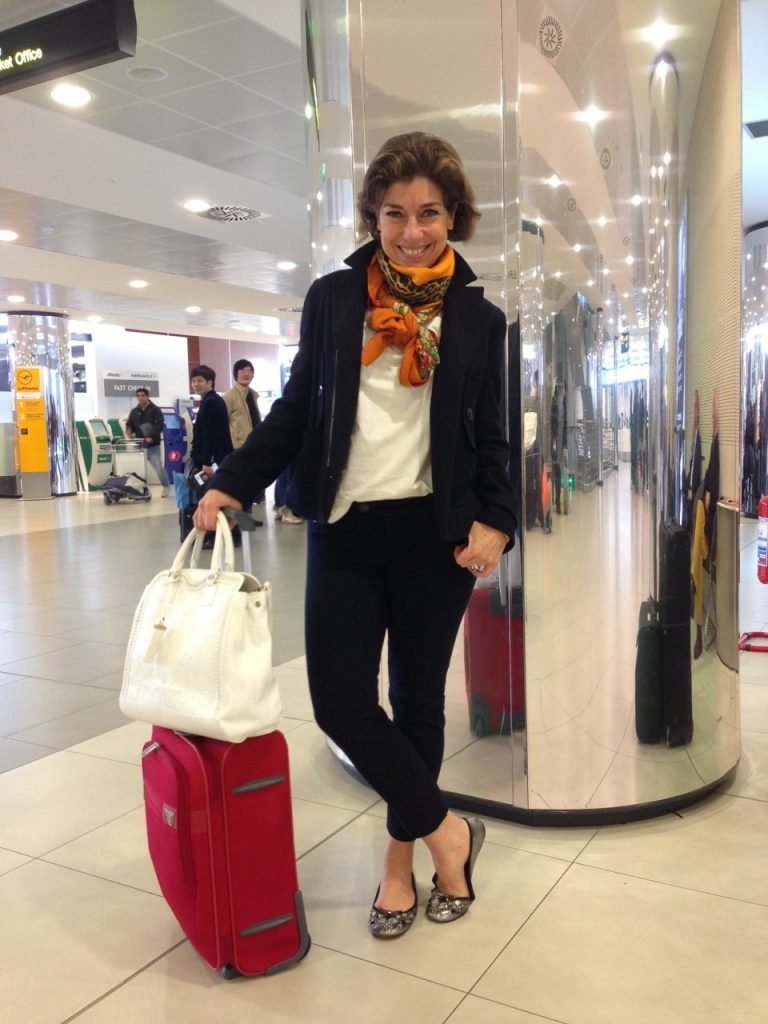 Navy Blazer and White T-Shirt with Black Trousers and Orange Scarf — Winter Airport Outfits